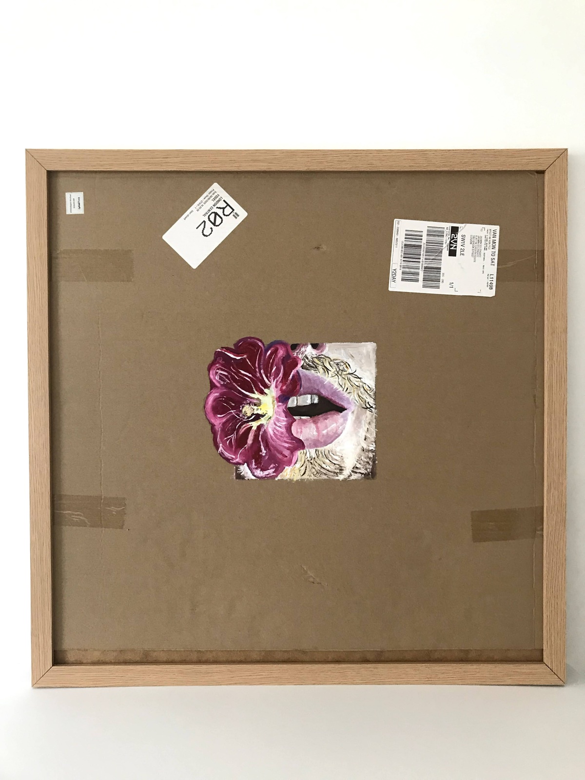 Painting by Jasmin Southgate: open lips beside a magenta flower, mounted in a wooden frame